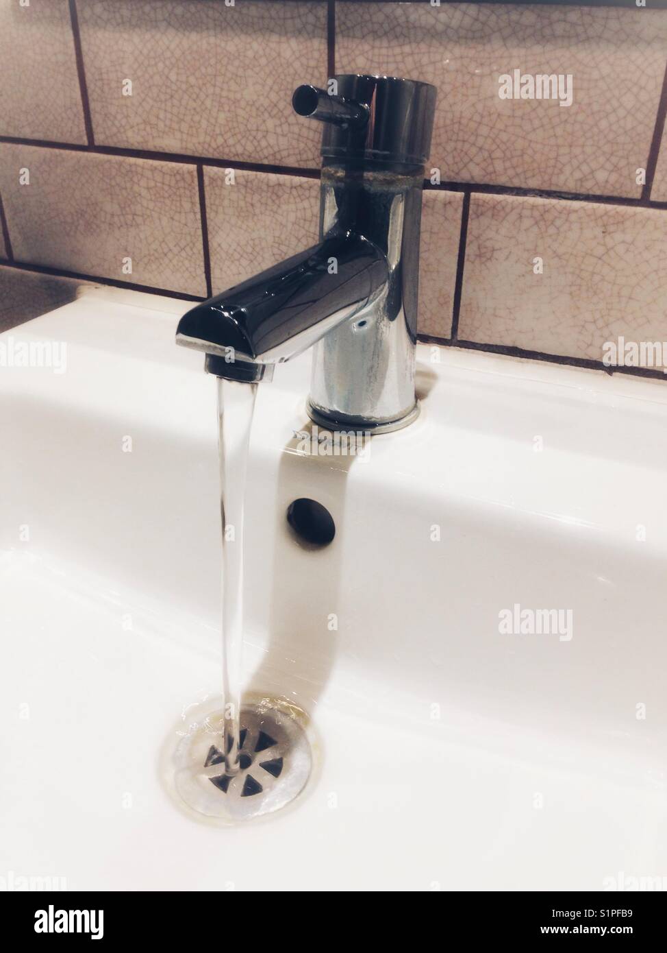 A running tap Stock Photo Alamy
