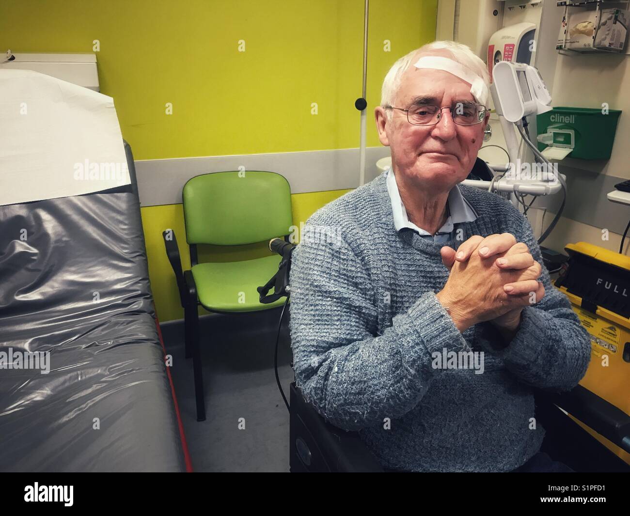 Senior man in A&E in hospital with a head injury, waiting to be assessed by the doctor. - Smartphone Captured Stock Image