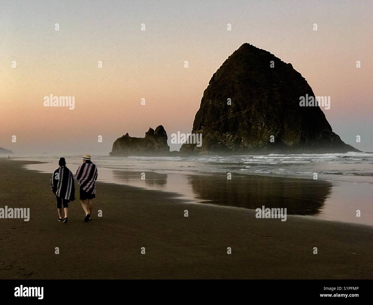 Sunrise and Haystack Rock, Cannon Beach, Oregon Stock Photo
