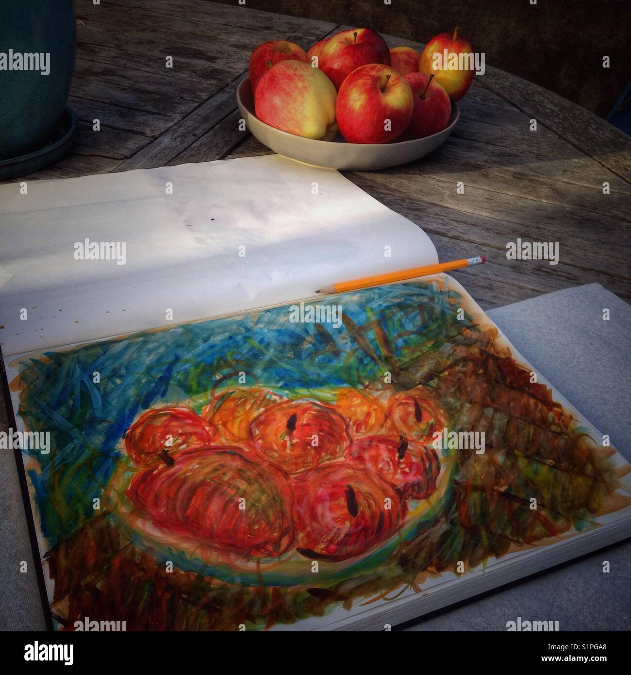 Still life with apples. A watercolor study in a sketchbook. - Smartphone Captured Stock Image