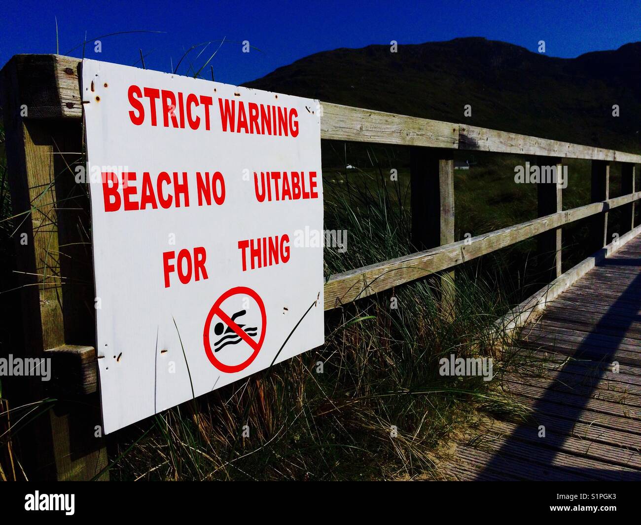 Strict warning beach not suitable for bathing sign signage - Smartphone Captured Stock Image
