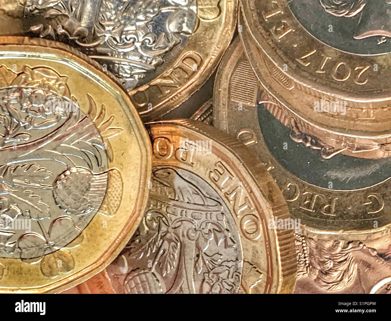 Currency. New 12-sided British £1 coins - Smartphone Captured Stock Image