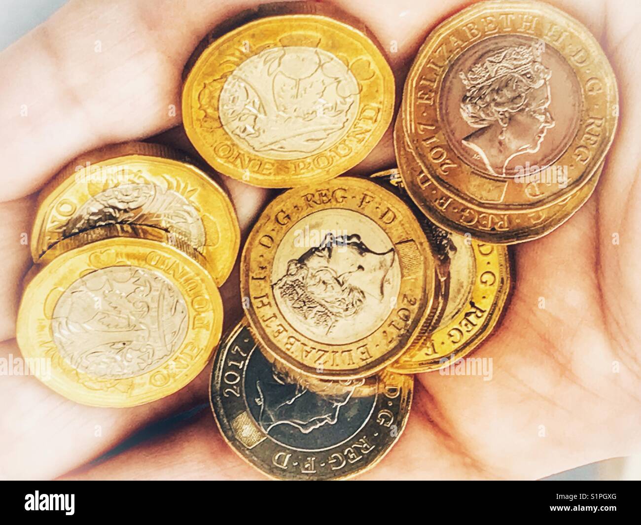 Currency. New British 12-sided £1 coins - Smartphone Captured Stock Image
