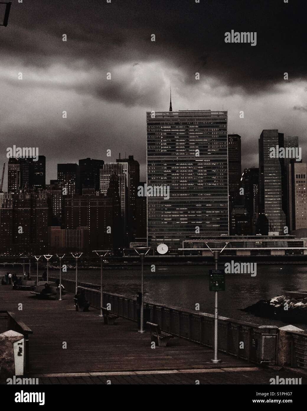 UNHQ building from Gantry Plaza State Park in Long Island City on a stormy afternoon Stock Photo