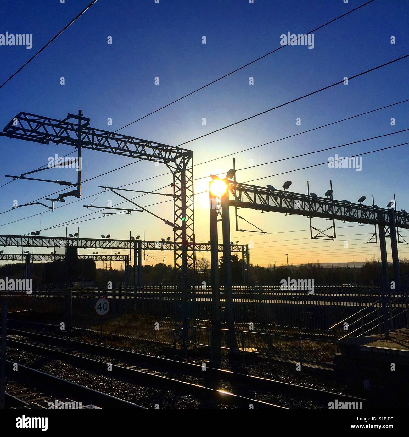 Railway Gantries at Sunrise - Smartphone Captured Stock Image