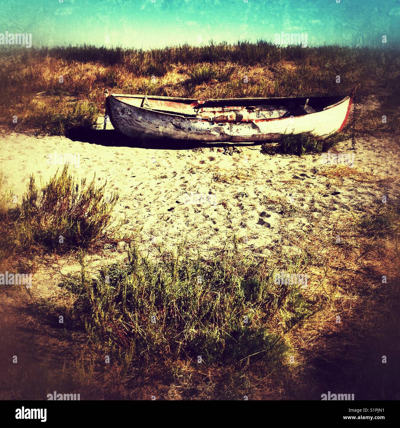 Old rusted boat on a sandy dunes - Smartphone Captured Stock Image