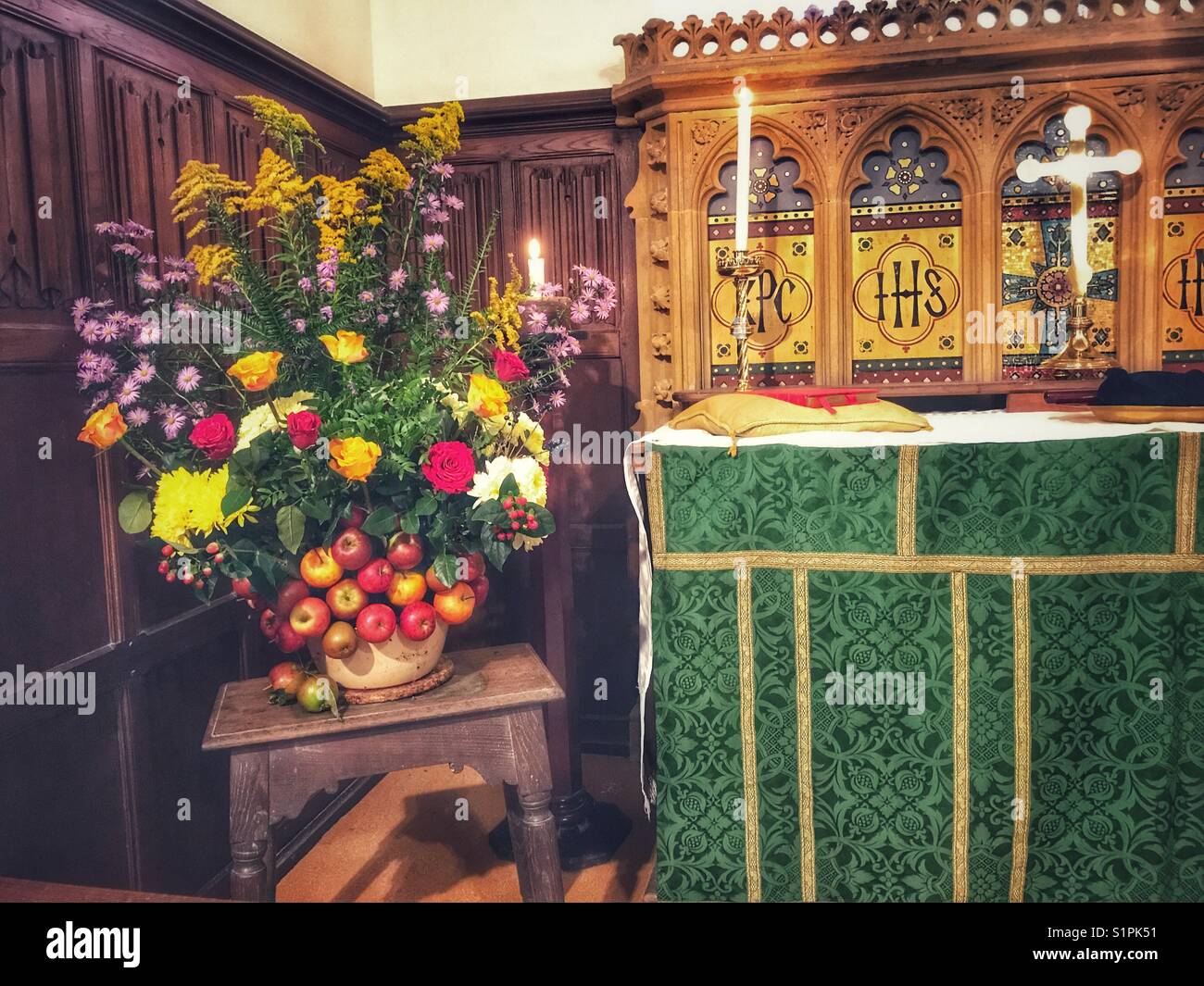 Harvest Festival. Fruit and floral arrangement decorating St Mary the Virgin Church In Compton Pauncefoot, Somerset, England. - Smartphone Captured Stock Image