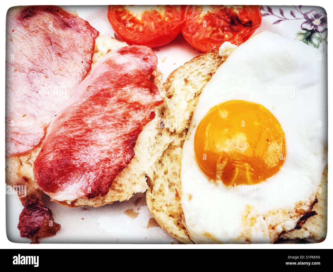 Egg and bacon roll with fried tomatoes - Smartphone Captured Stock Image