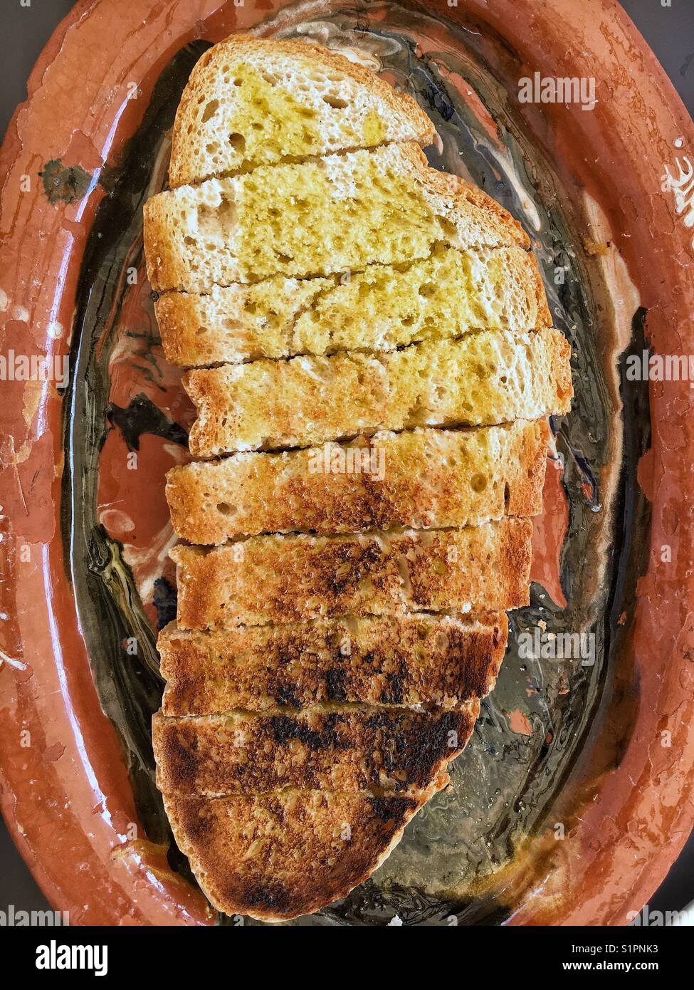 Toast with olive oil Stock Photo Alamy