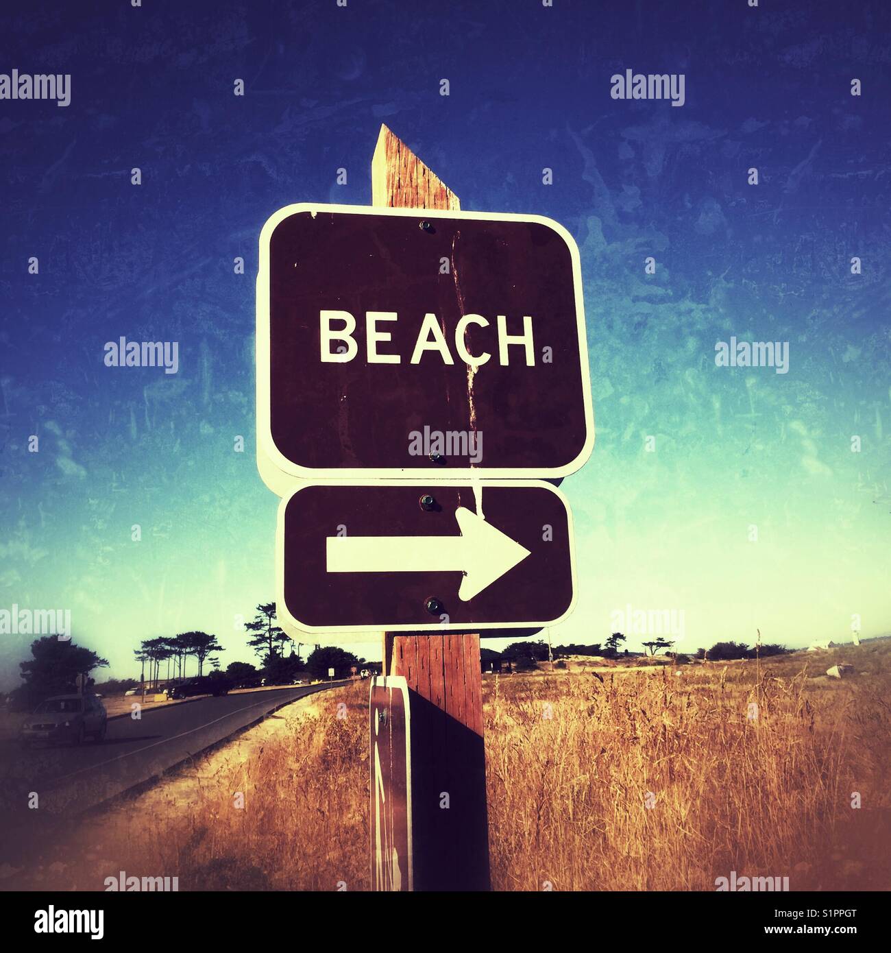 Arrow and sign with word BEACH at Fort Warden state park on Olympic Peninsula, WA - Smartphone Captured Stock Image