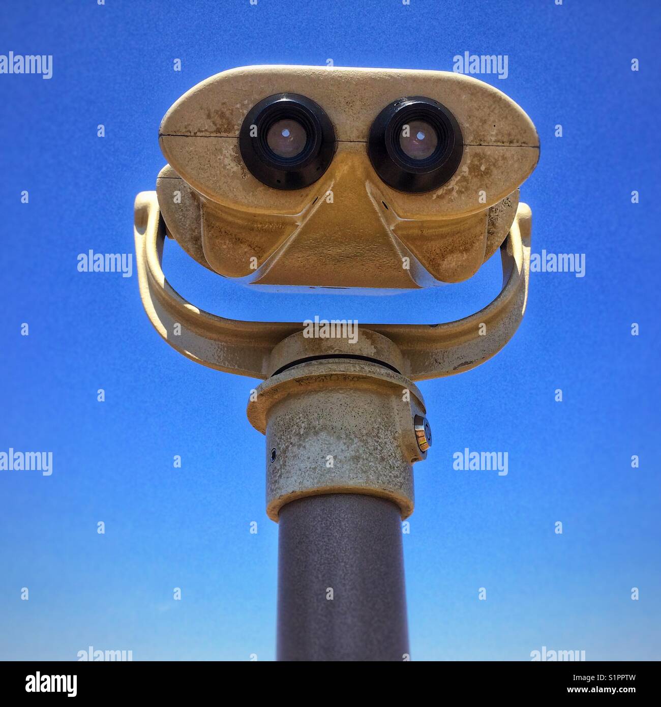 Sightseeing binoculars in blue sky background Stock Photo Alamy