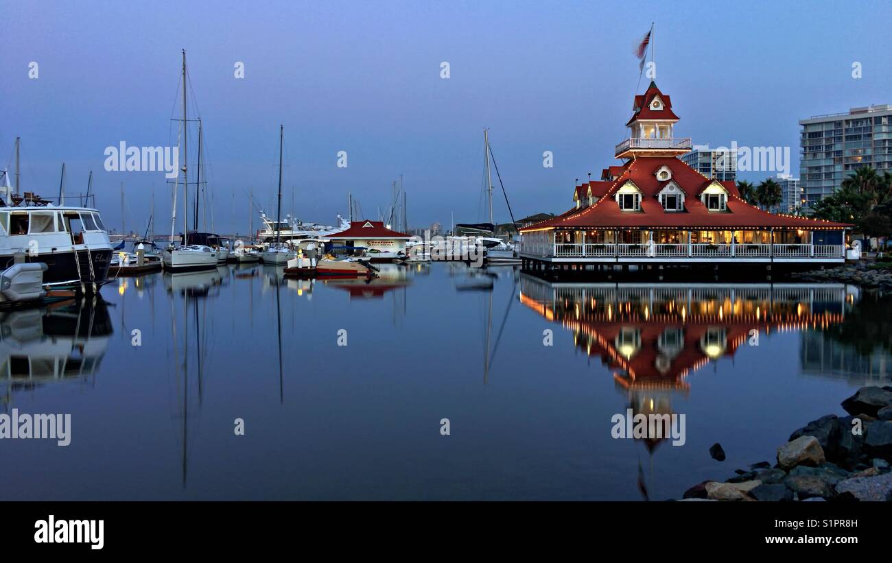 Coronado, California - August 31, 2017: The historic former Hotel Del Coronado boathouse on the harbor in Coronado Island. It is currently the Bluewater Boathouse Seafood Grill. Stock Photo