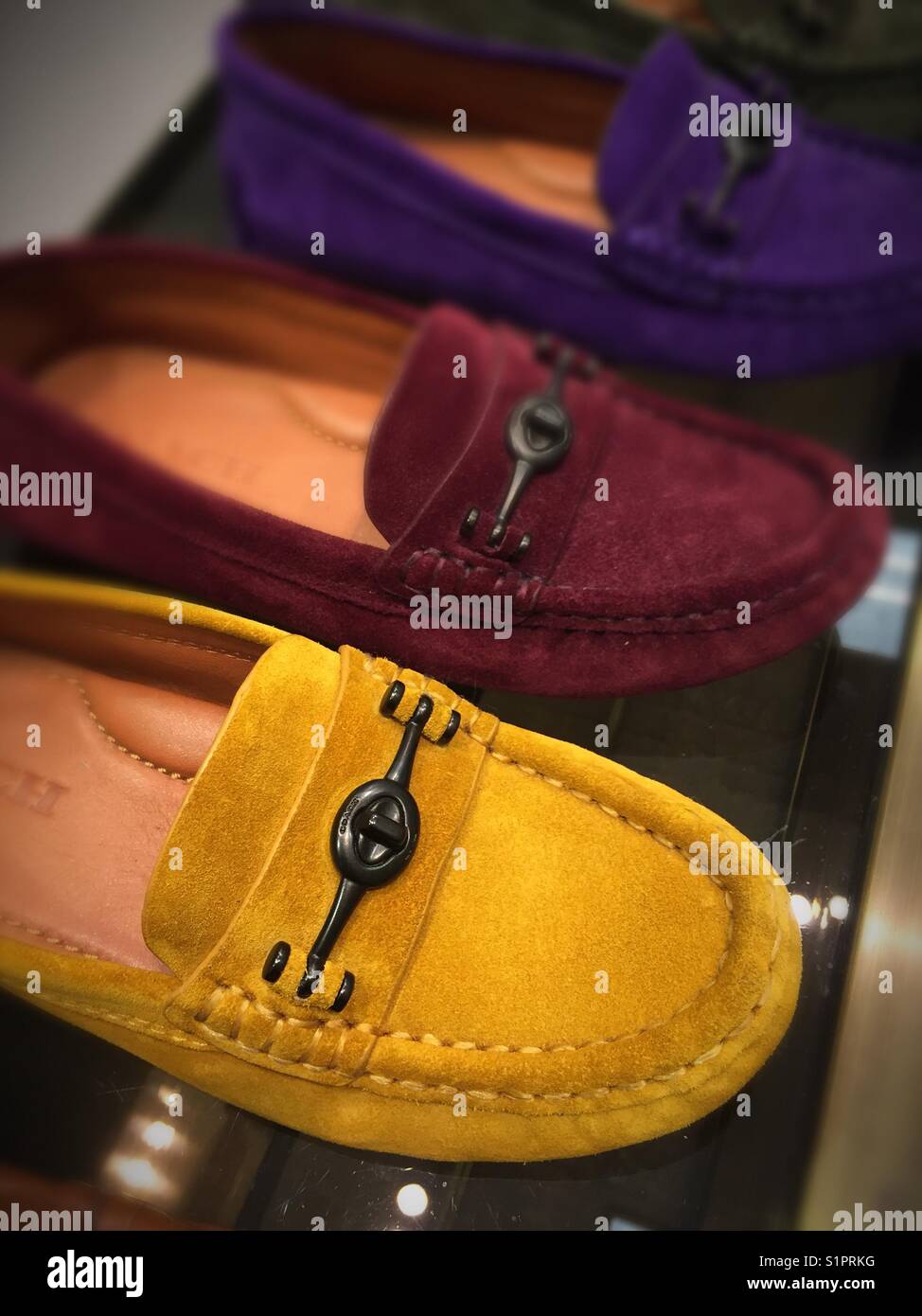 Ladies suede loafers on display in shoe departments USA - Smartphone Captured Stock Image