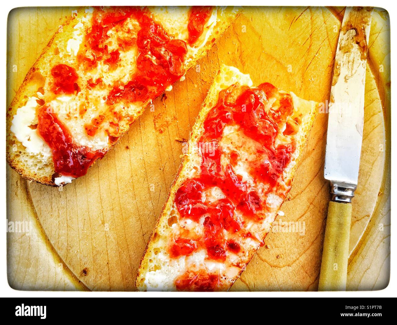 Baguette with strawberry jam - Smartphone Captured Stock Image