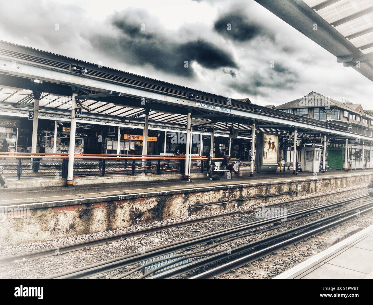Guildford train station, platform and rail tracks Stock Photo