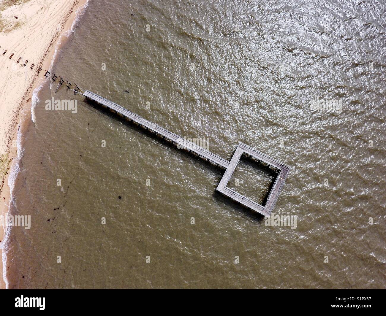 Damaged pier from tropical storm Stock Photo