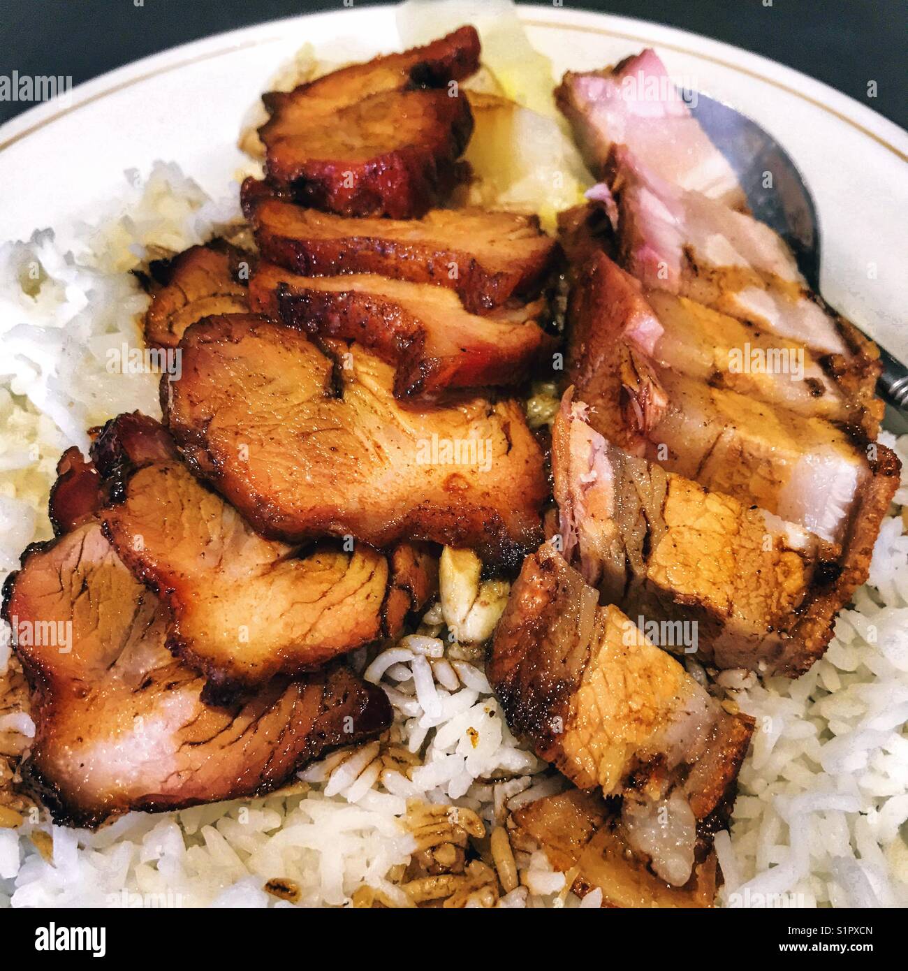 Honey roast pork char siu and crispy pork belly with rice Stock Photo