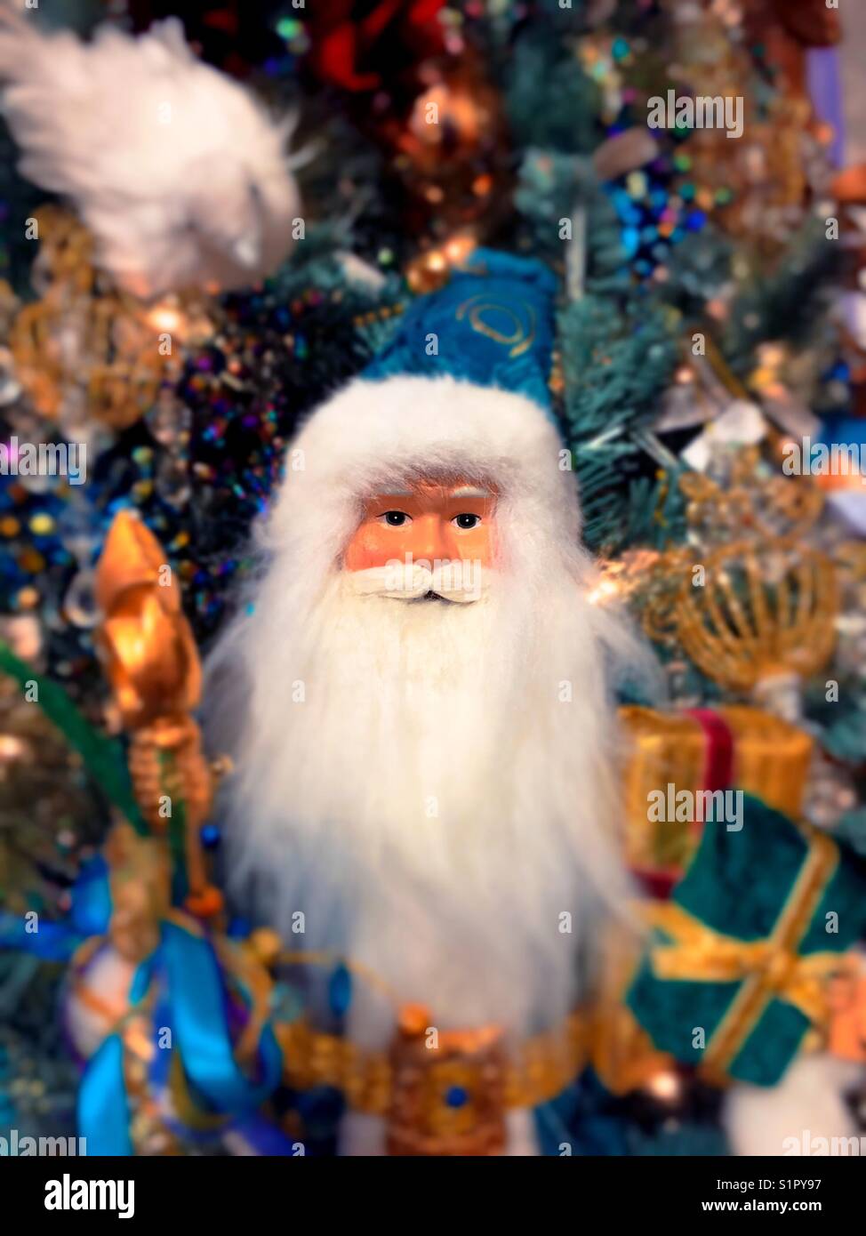 Santa Claus figure in front of a Christmas Tree add Macy’s holiday Lane display, NYC, USA - Smartphone Captured Stock Image
