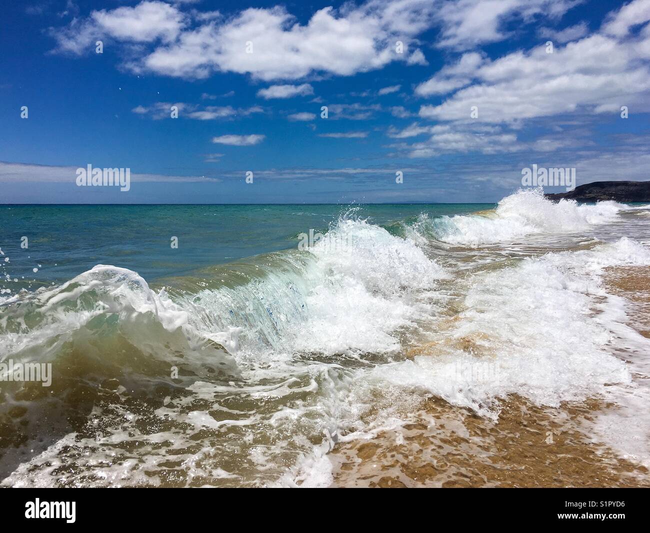Waves crashing in tropical sandy beach - Smartphone Captured Stock Image Waves crashing in tropical sandy beach - Smartphone Captured Stock Image