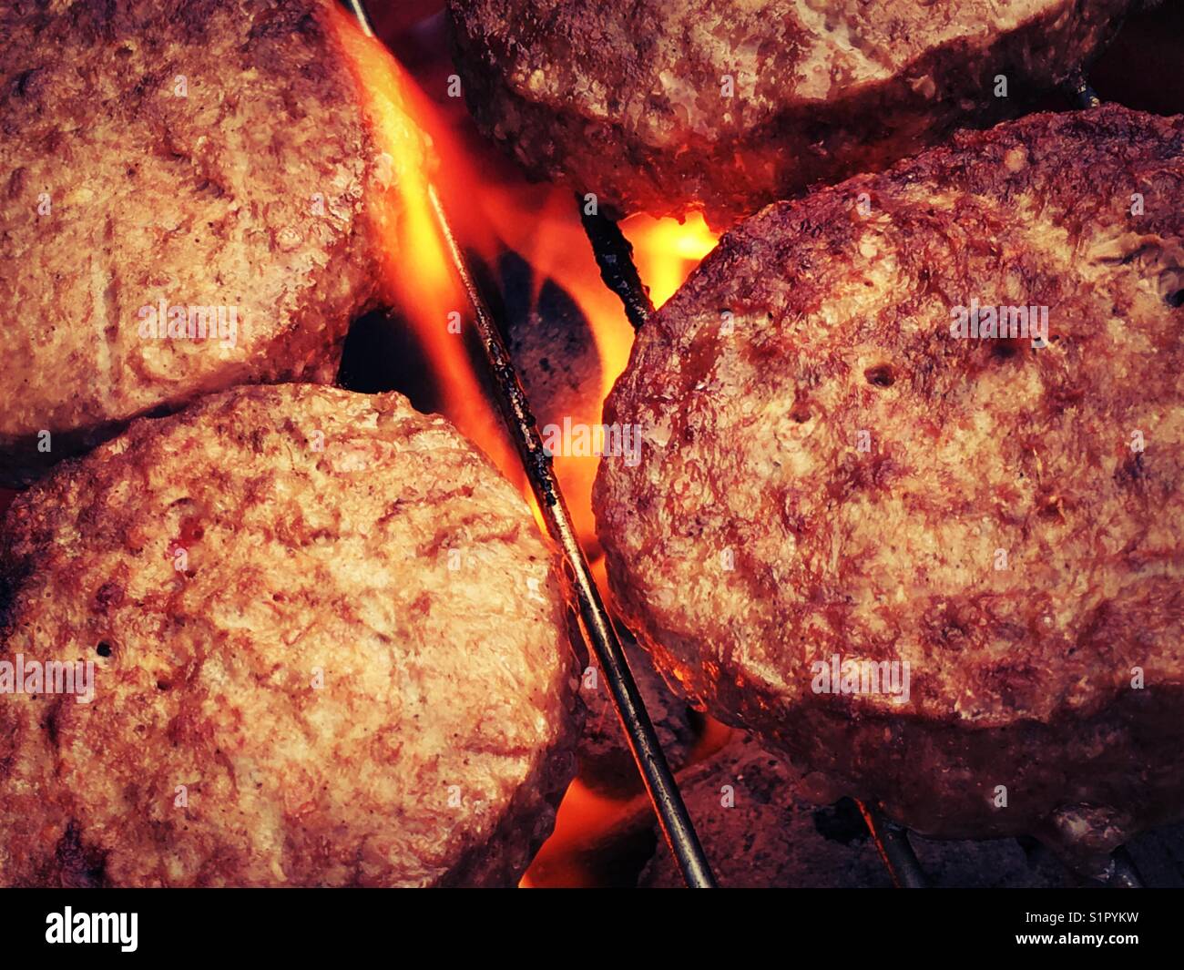Beef burgers on the barbecue Stock Photo Alamy