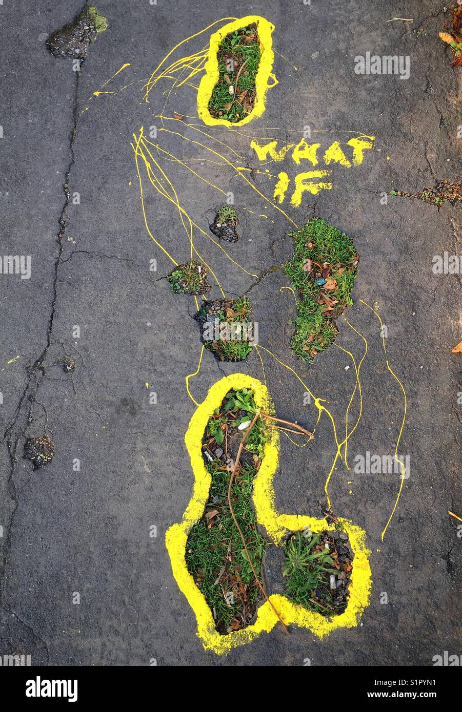Cryptic graffiti reading “WHAT IF” on a pavement in Weston-super-Mare, UK Stock Photo