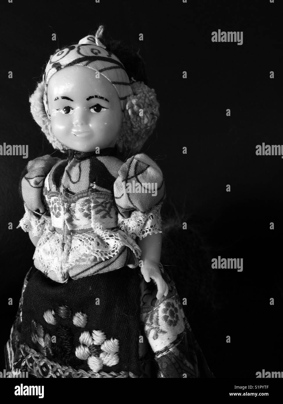 Black and white vintage plastic gypsy doll closeup - Smartphone Captured Stock Image