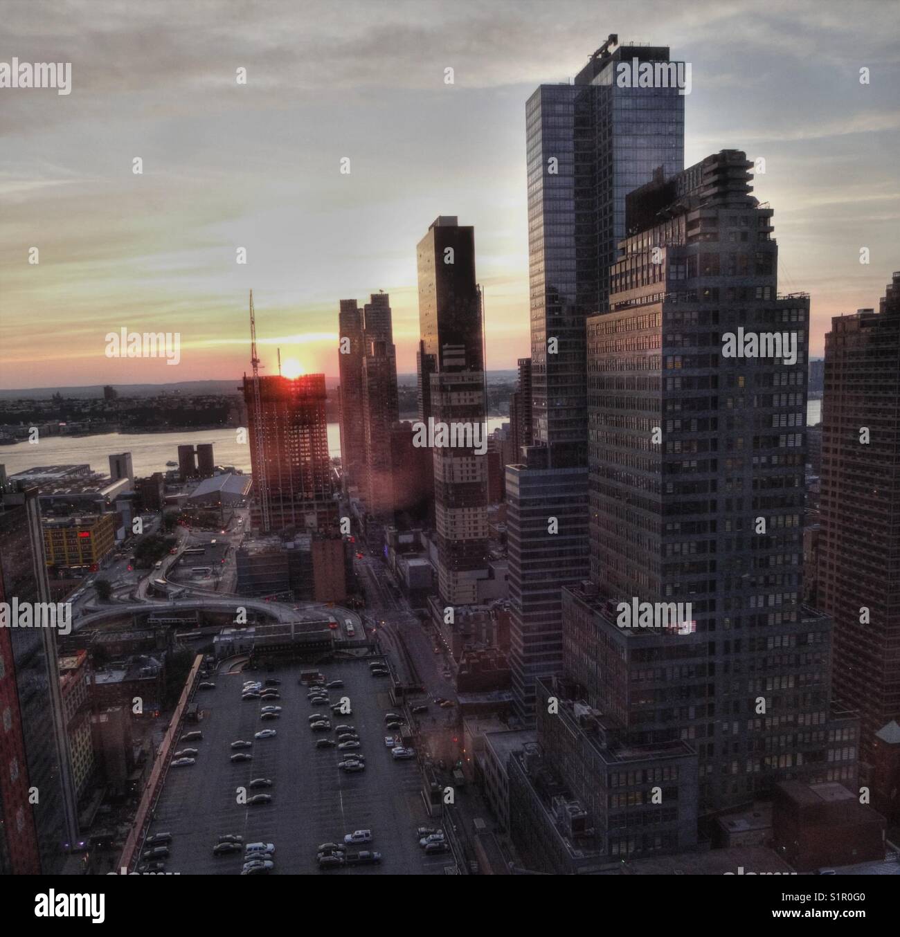 Sunset from elevated floor of the New York Times building, view of Port Authority bus terminal and Hudson River Stock Photo