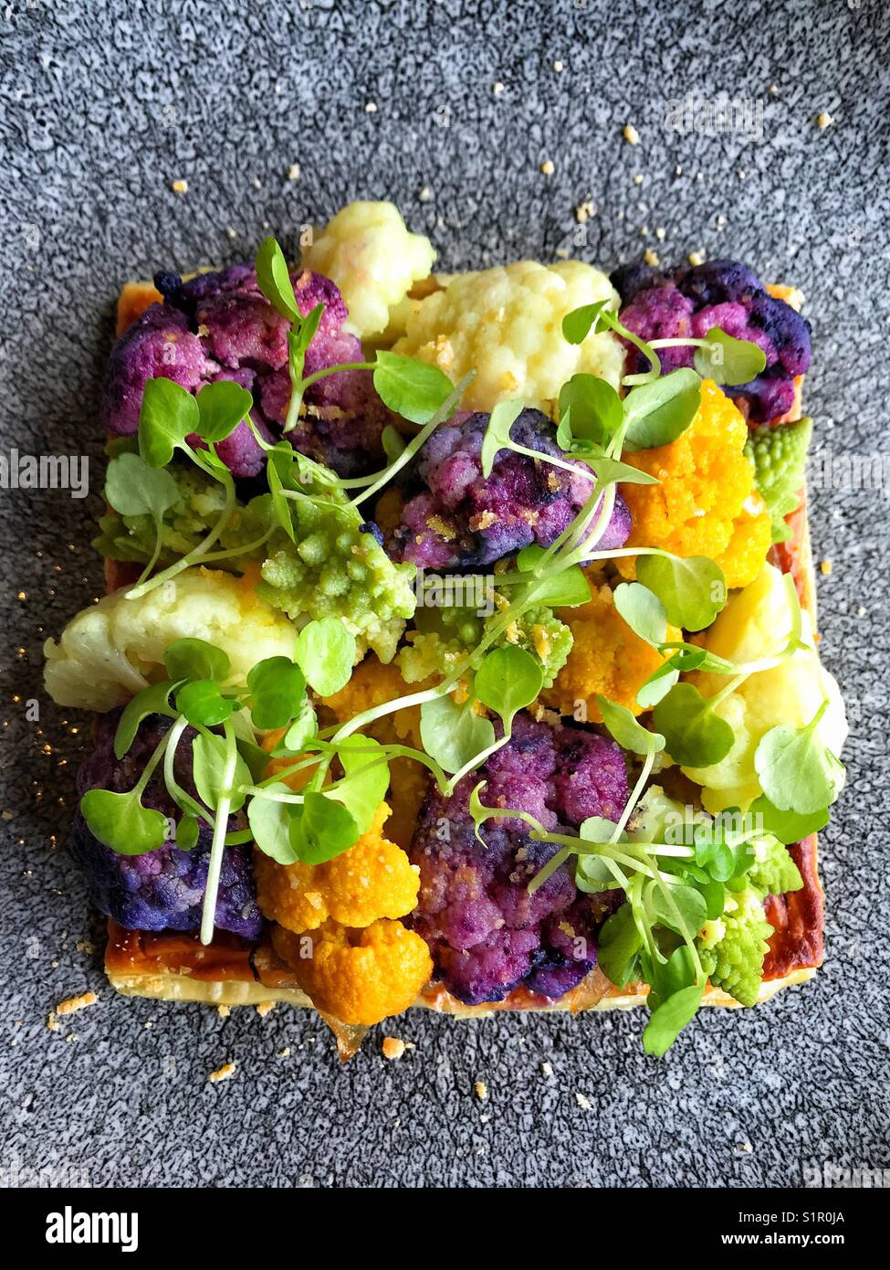 Cauliflower galette. Variety of cauliflower roasted on top of puff pastry - Smartphone Captured Stock Image