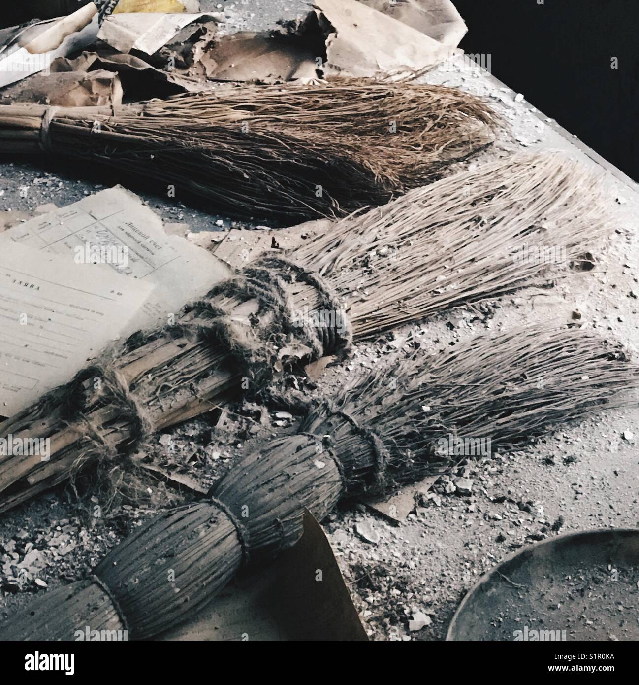 Brooms left on a table in a classroom in Pripyat City, Ukraine. - Smartphone Captured Stock Image