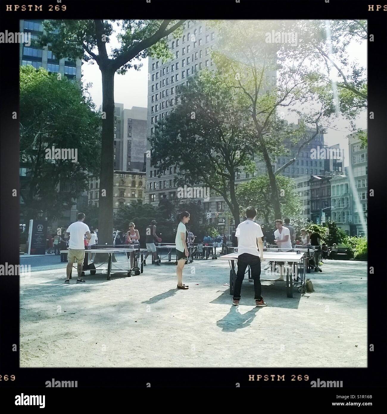 Early twenties people playing ping pong at Madison Square Park in Manhattan Stock Photo