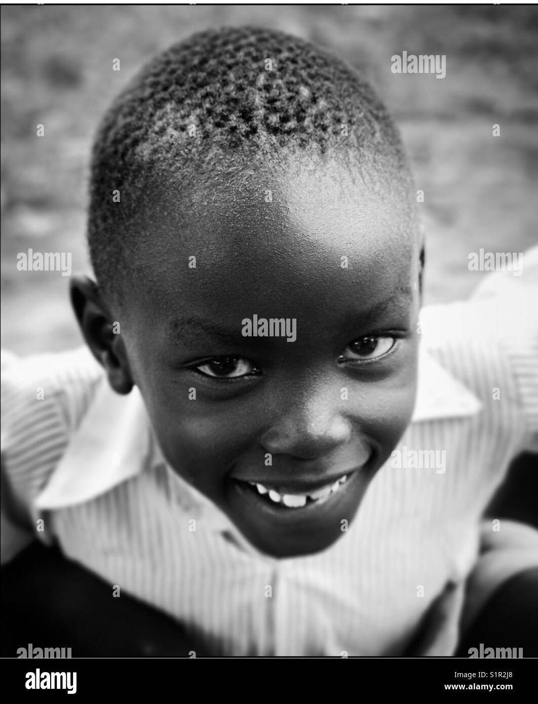 Ugandan schoolboy smiles for the camera Uganda Africa Stock Photo