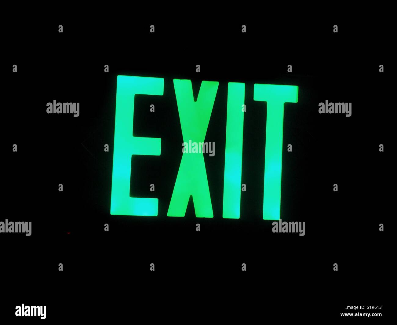 Green exit neon signage Stock Photo