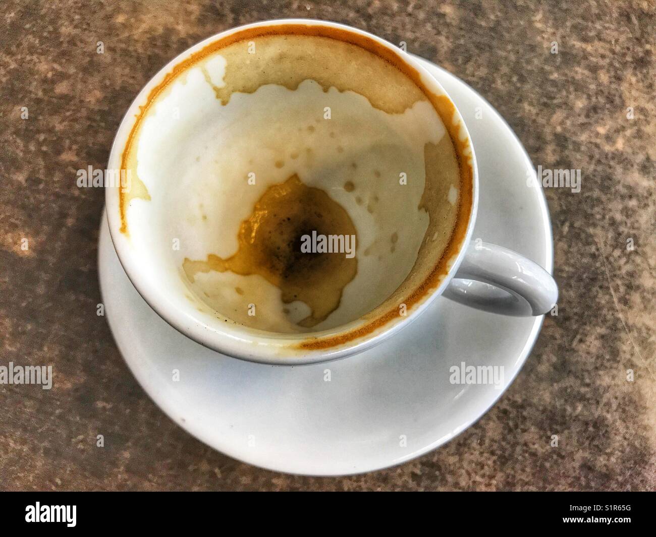 Empty coffee cup on a table, high angle view - Smartphone Captured Stock Image