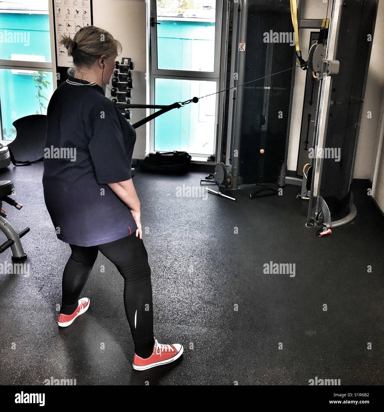 Woman exercising In gym - Smartphone Captured Stock Image