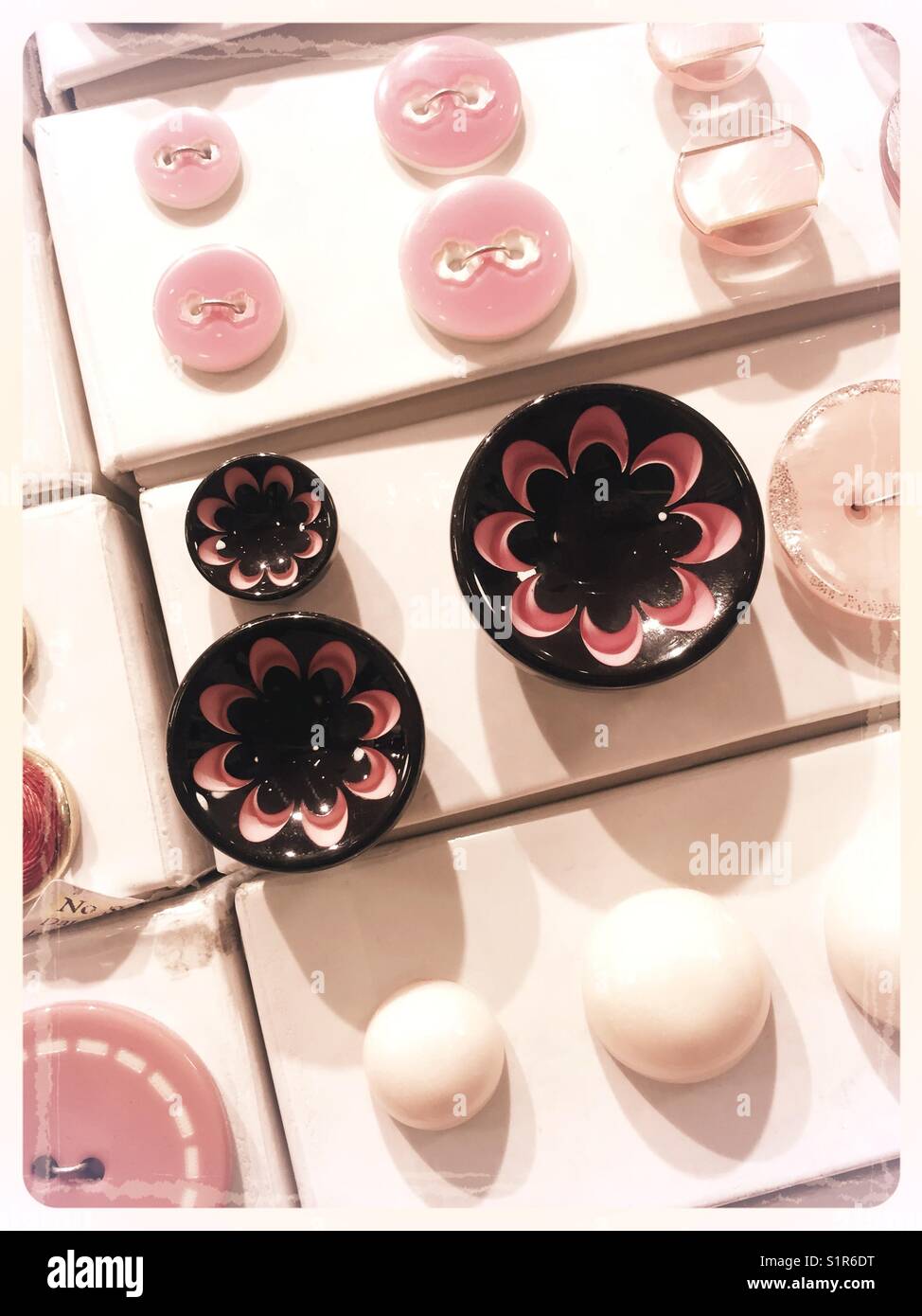 Button boxes in retail trim shop, garment district, NYC, USA - Smartphone Captured Stock Image