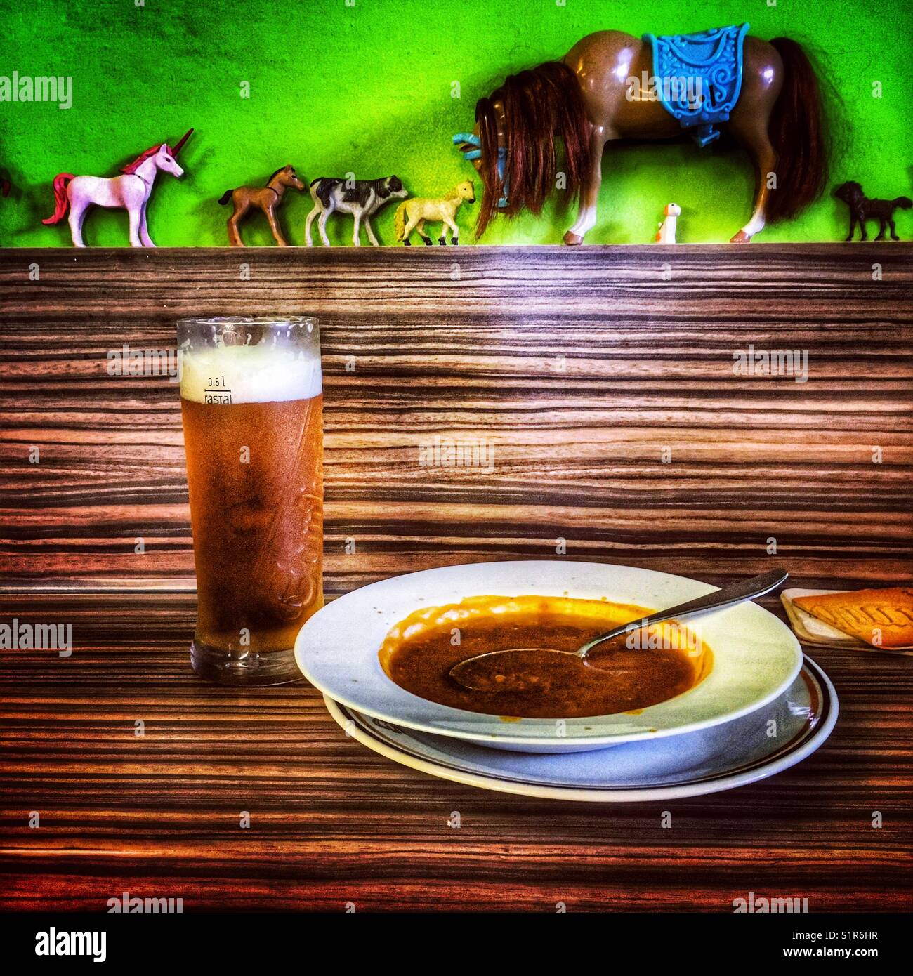 Beer and goulash soup in a cheap buffet with a horses, toy decoration, Czech republic Stock Photo