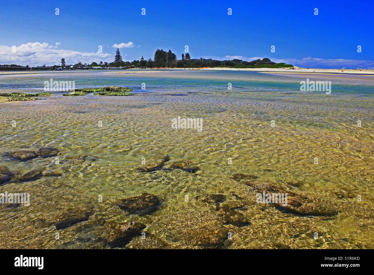 Ocean rocks and sand through clear water - Smartphone Captured Stock Image