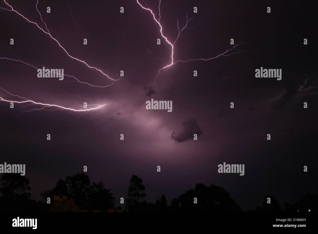 Bolts of lightning across dark sky - Smartphone Captured Stock Image