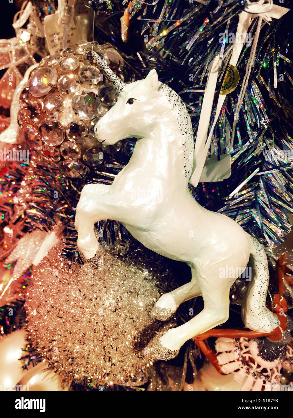 Holiday Display of unicorn Christmas ornament, USA - Smartphone Captured Stock Image