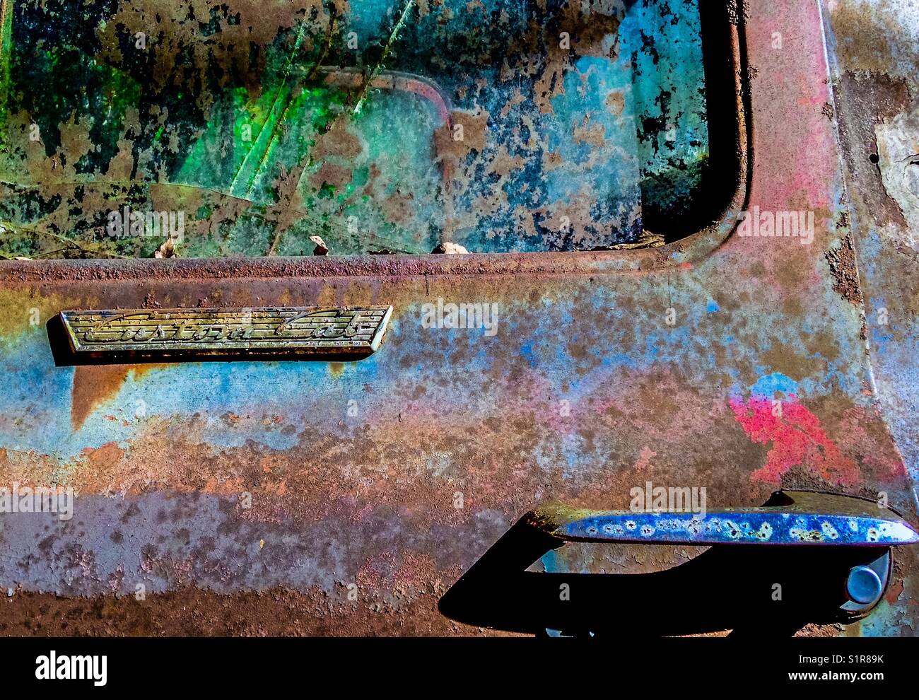 Driver's side door of rusted vintage Ford pickup - Smartphone Captured Stock Image