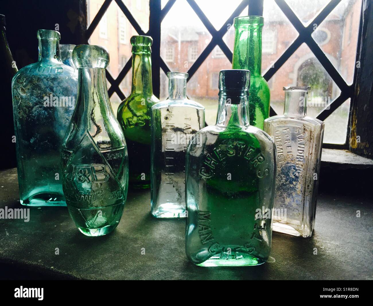 Antique Bottles on a Window Sill Stock Photo