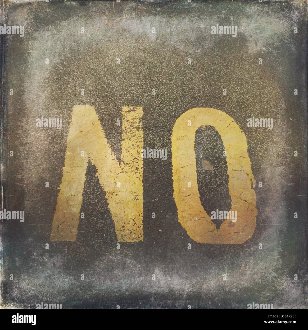 The word NO painted on the asphalt - Smartphone Captured Stock Image