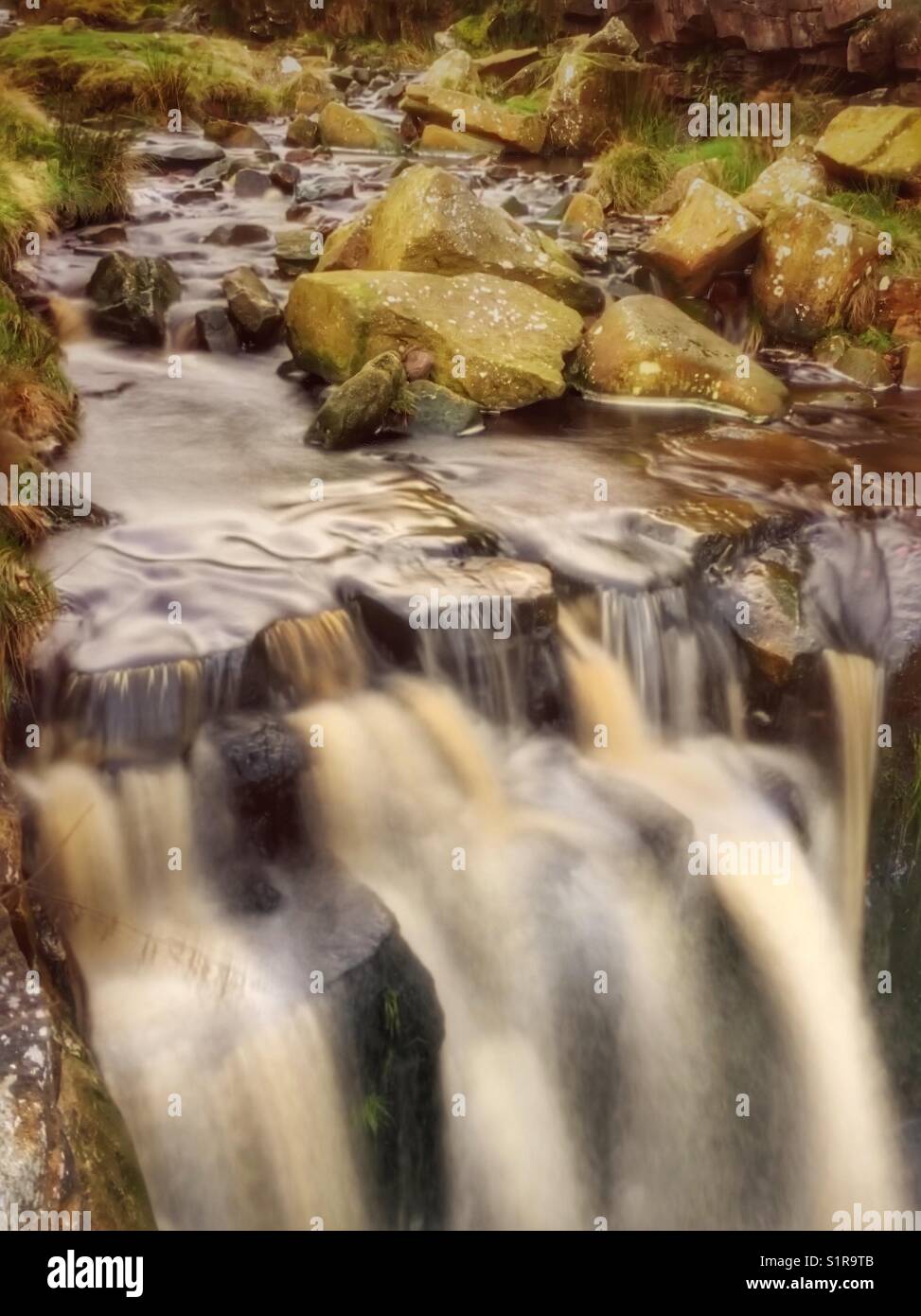 Water flowing over rocks at White Coppice near Chorley in Lancashire - Smartphone Captured Stock Image