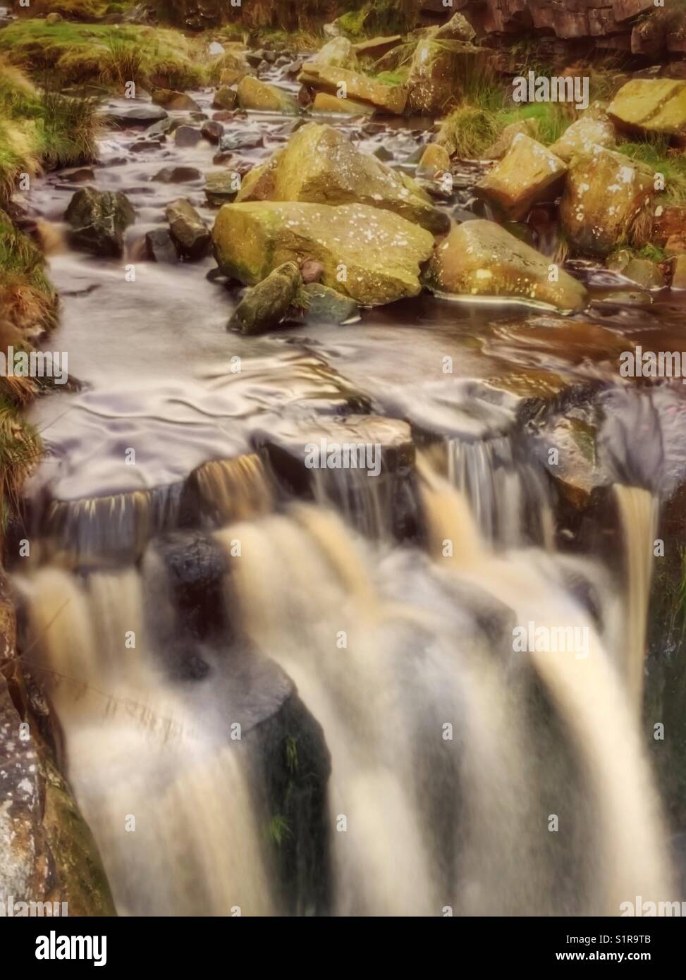 Water flowing over rocks at White Coppice near Chorley in Lancashire Stock Photo