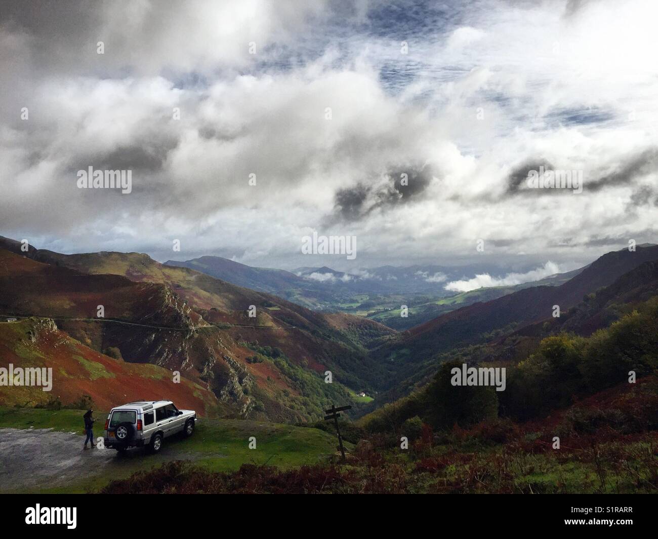 Land Rover overlooking the French Pyrenees in the Basque country. Stock Photo