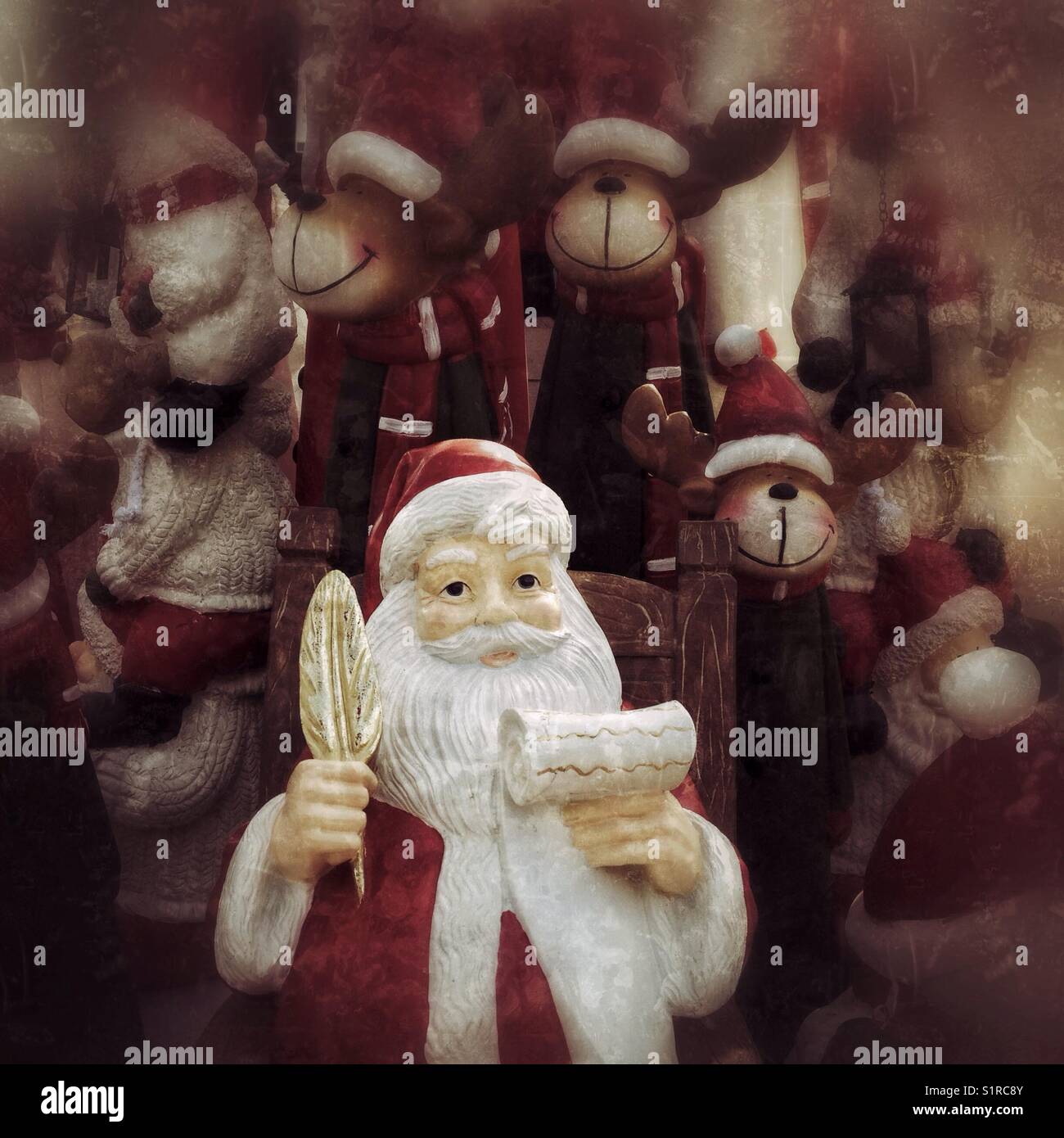 Santa and his helpers. Christmas figures from a garden centre. - Smartphone Captured Stock Image
