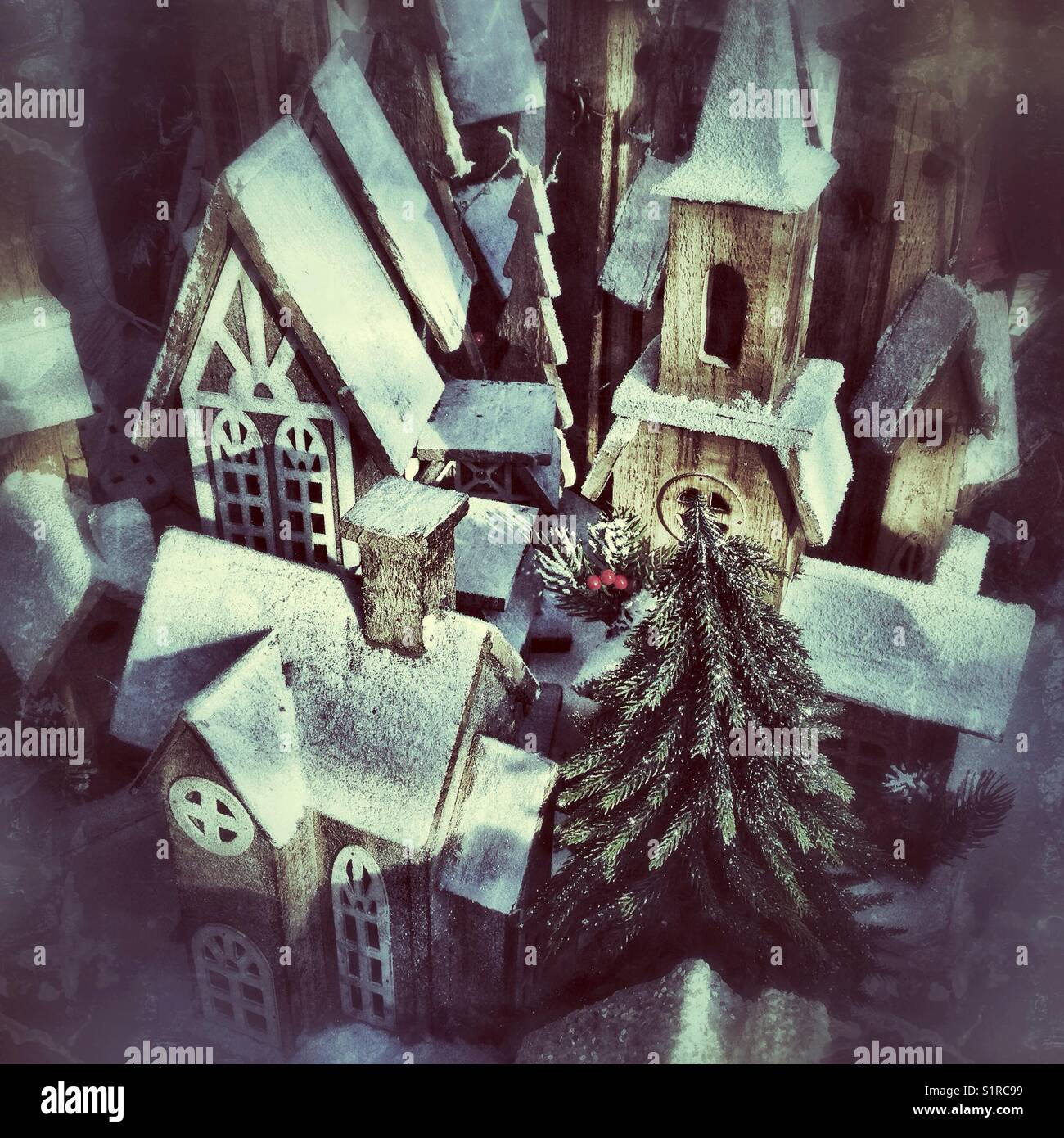 Little wooden houses covered in snow; Christmas decorations at a local ...