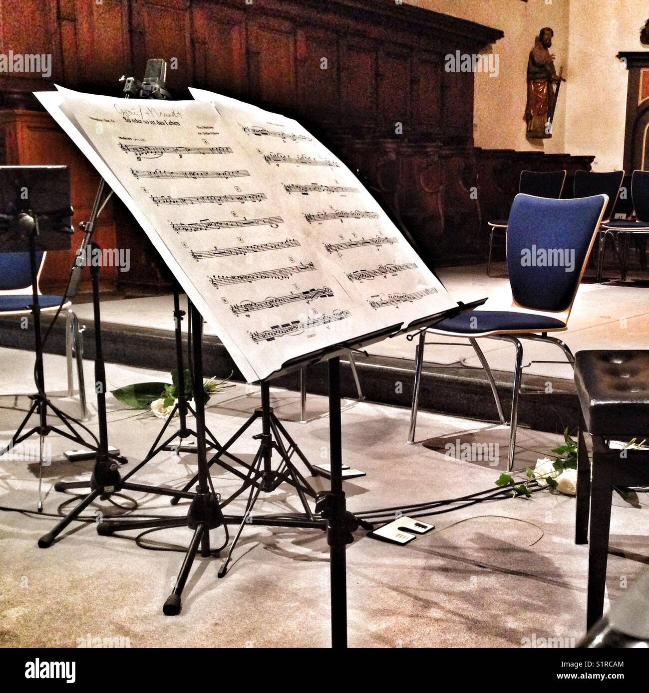 Music sheets on a stand in a church. - Smartphone Captured Stock Image
