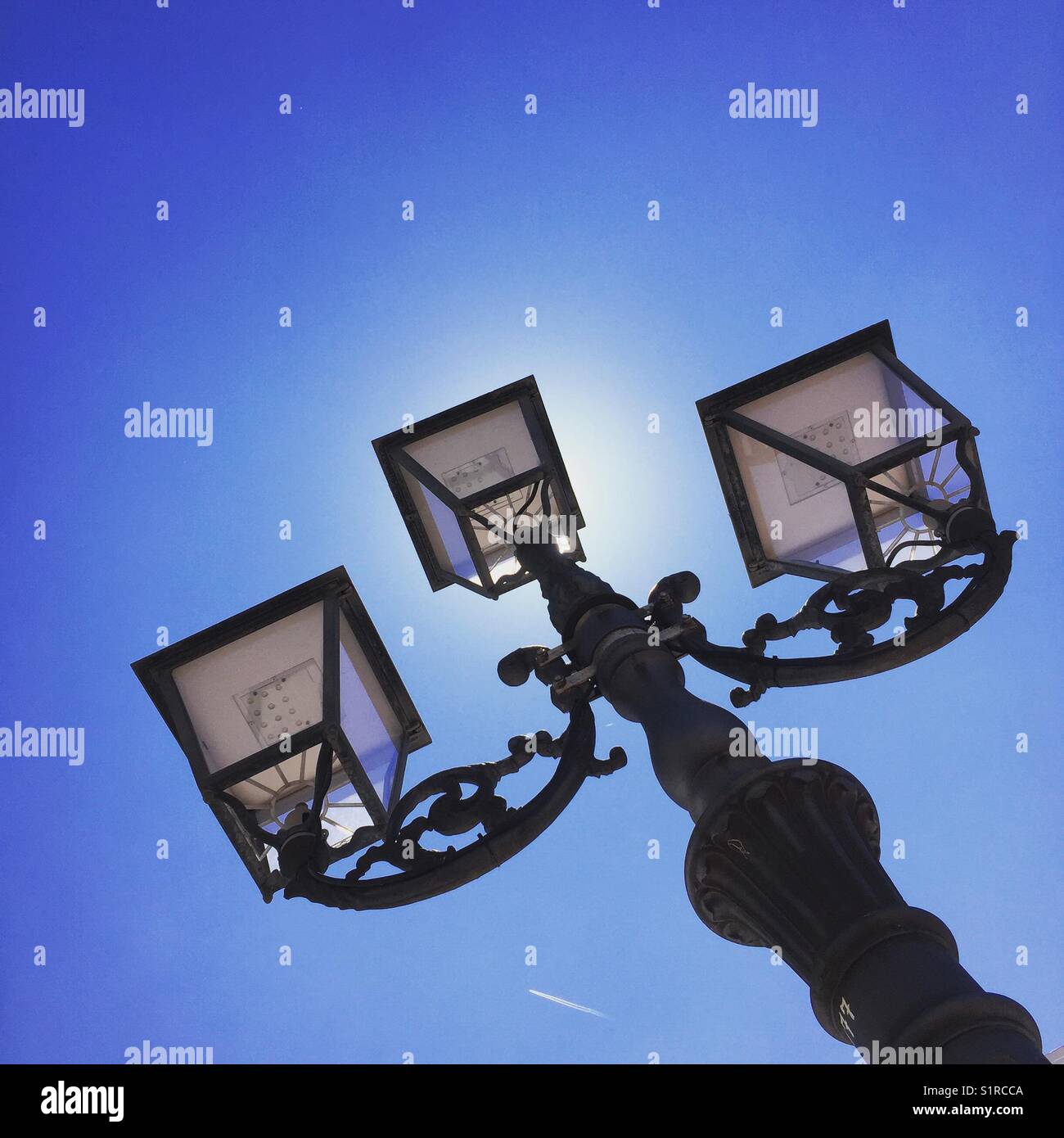 Lamp post against blue sky - Smartphone Captured Stock Image