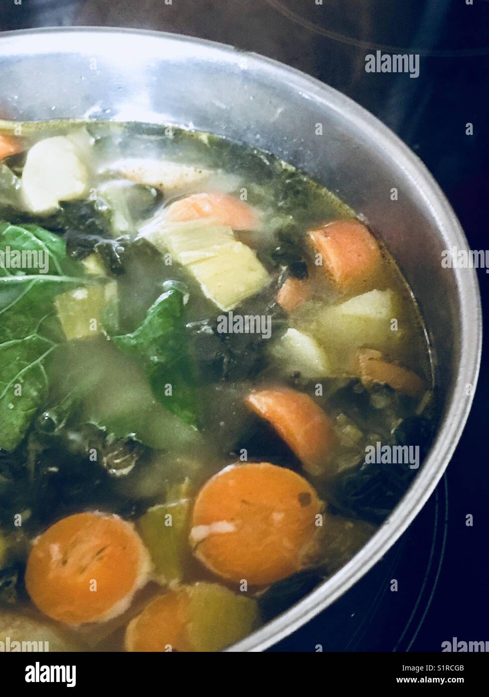 Vegetable soup with organic Cornish carrots potatoes leeks and chard. - Smartphone Captured Stock Image